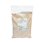 Stone-ground whole wheat flour pouch, 500 g, with TOMIZAWA label on front
