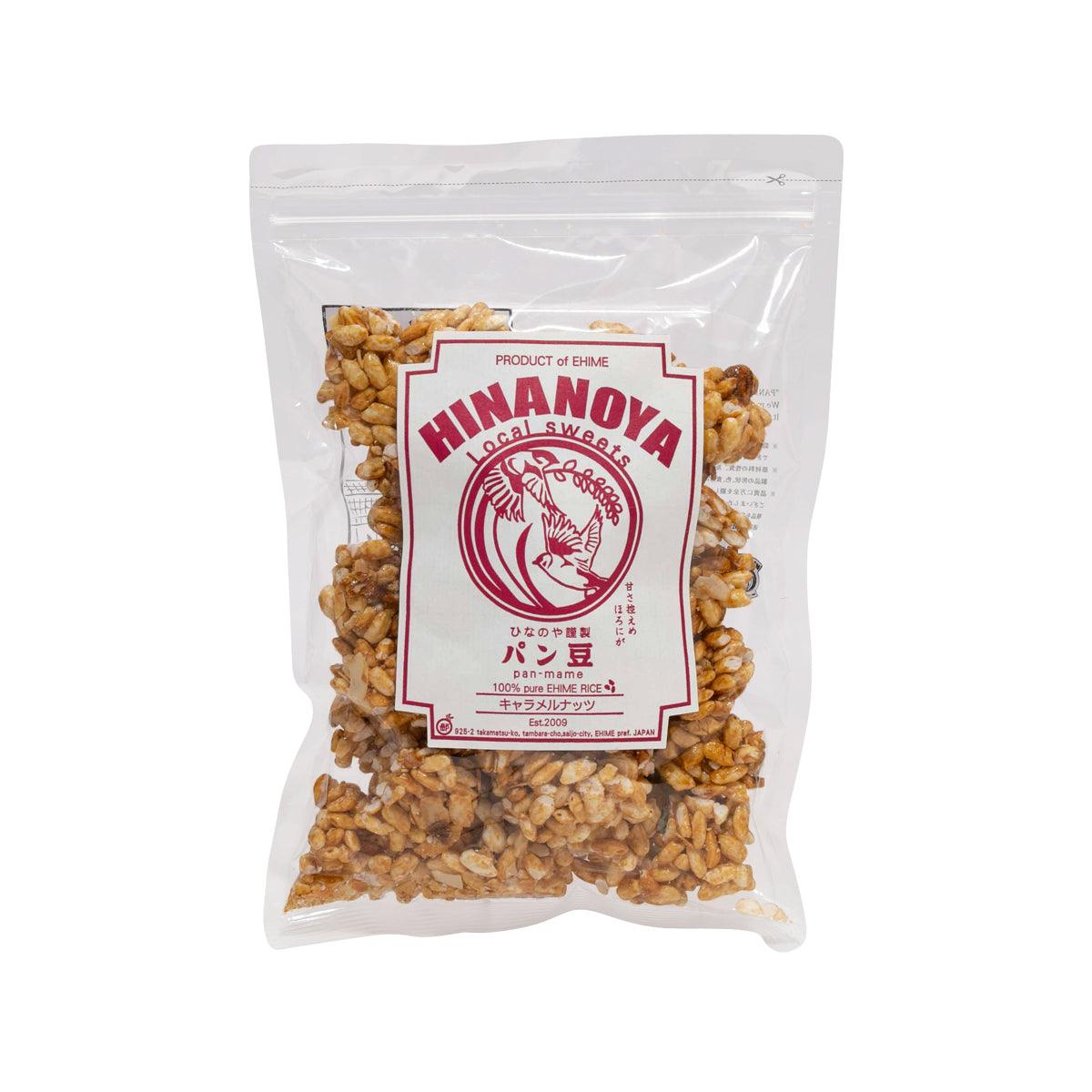 HINANOYA caramel & nuts rice puff snack bag, clear pouch with HINANOYA label