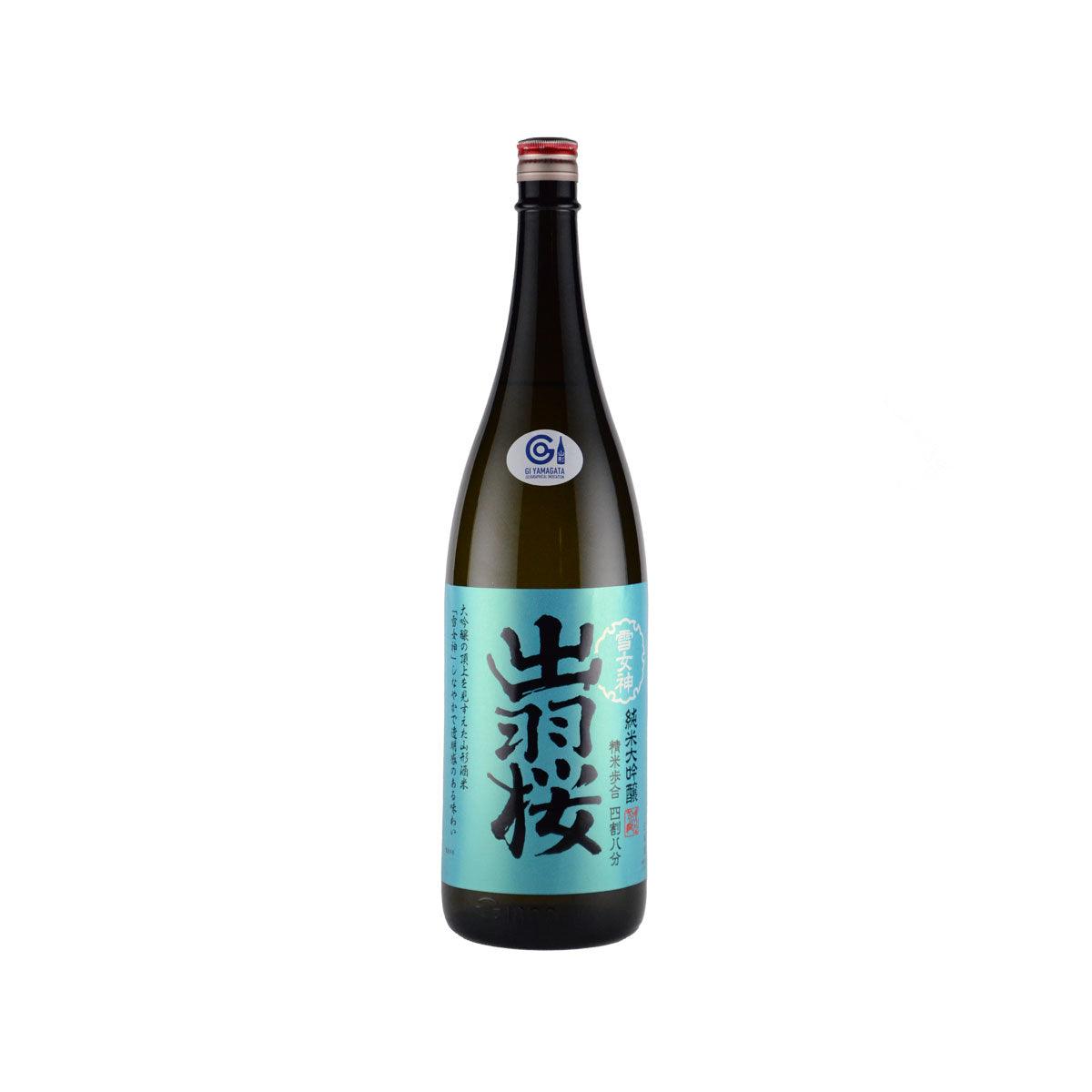 DEWAZAKURA sake bottle, dark glass, red cap, blue label