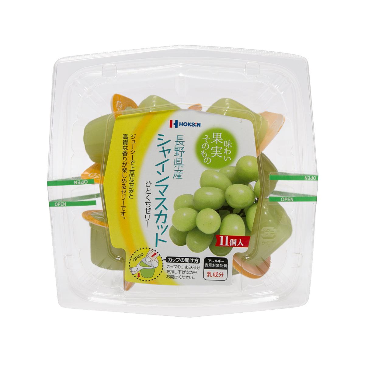 Grape-flavored jelly snack in clear plastic tray with green jelly pieces