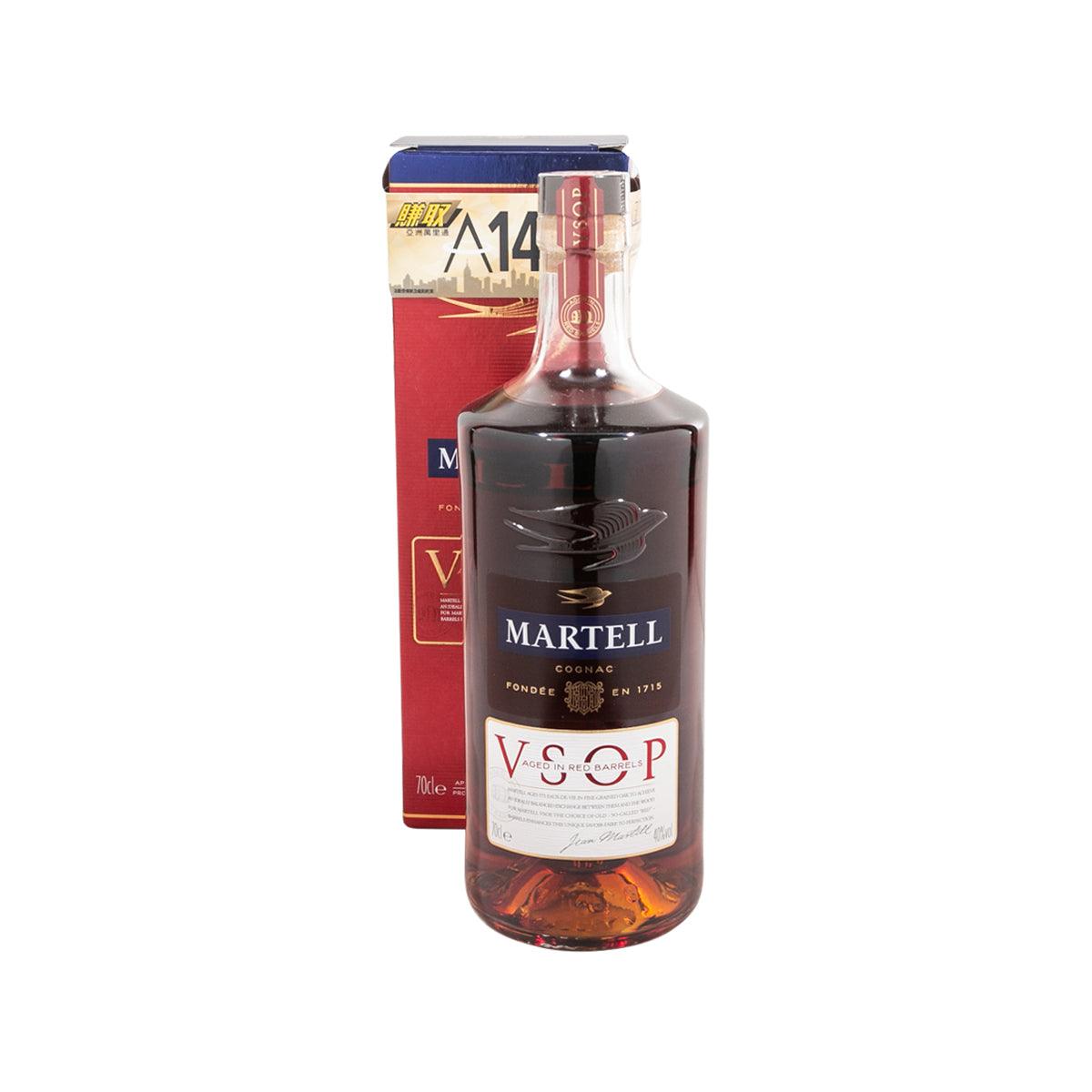 Martell VSOP Cognac bottle with amber liquid, blue cap, and red boxed packaging