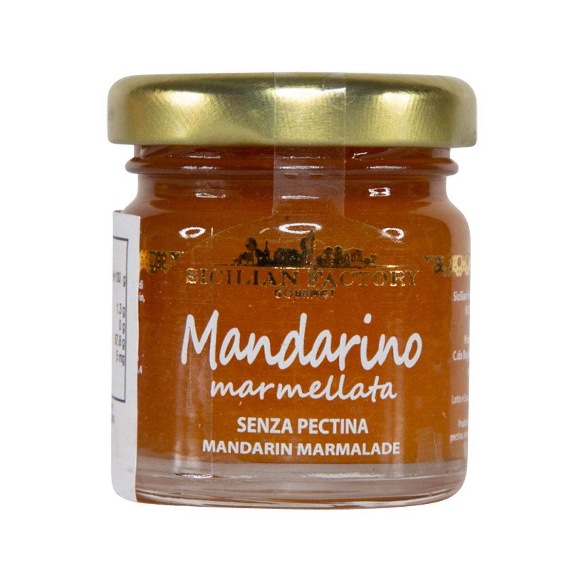 Mandarin marmalade jar with gold lid and amber orange jam, front label visible.