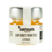 Raw citrus honey jar with SANTAGATA label and metallic cap