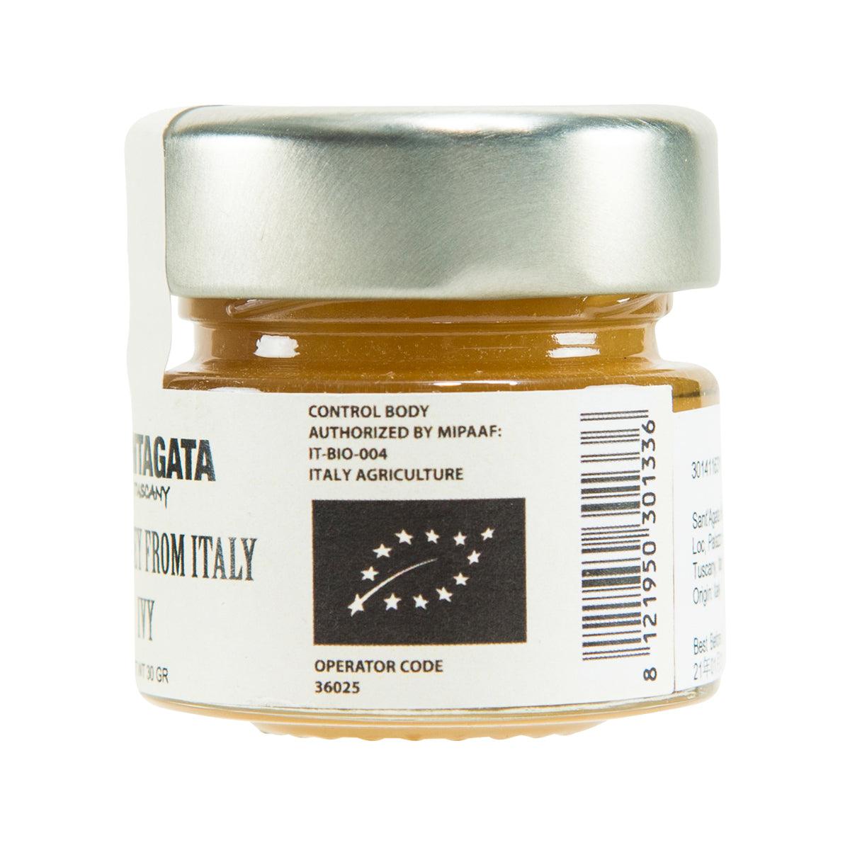 Raw ivy honey jar back label with barcode and control info, silver lid