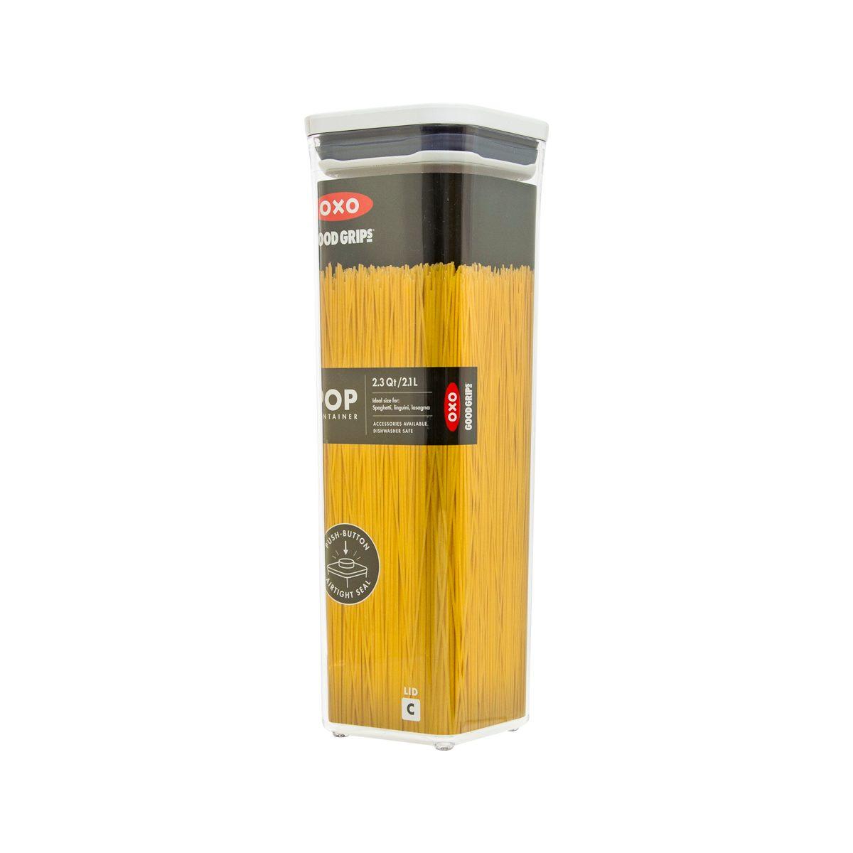 Small square OXO POP container with clear body, black label, and yellow spaghetti inside