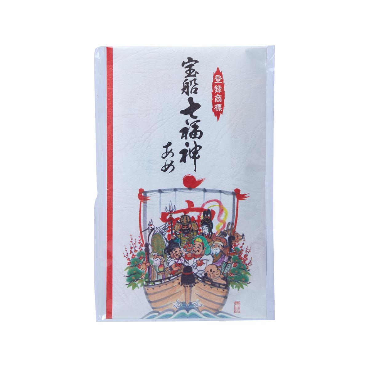 Seven Lucky Gods candy pack: illustrated boat of characters on white with red stripe.