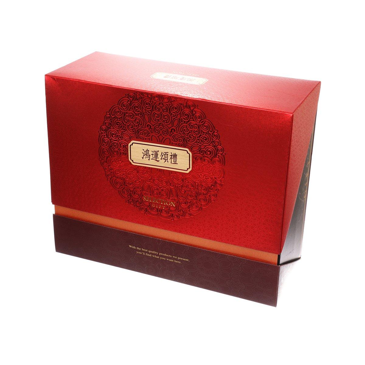 Premium gift set box, red with gold emblem label on front, angled view
