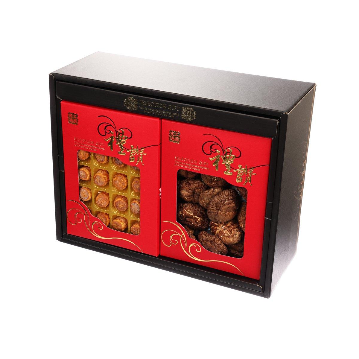 Open selection gift set box with two red panels showing assorted treats through windows