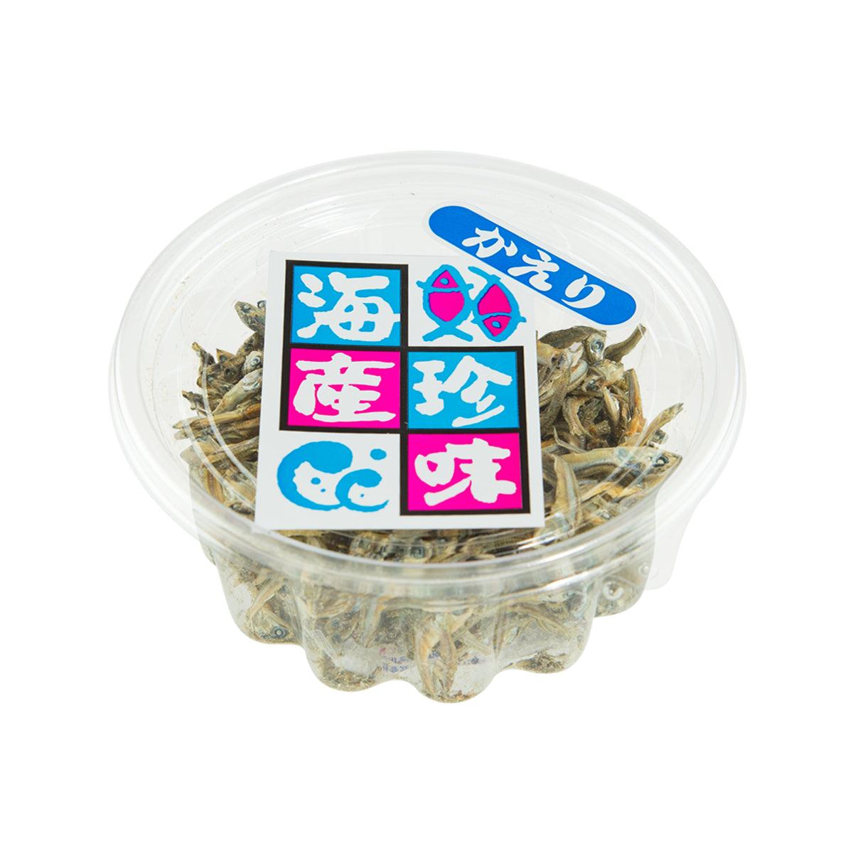 Dried Japanese anchovy kaeri in clear plastic tub with blue label, fish visible