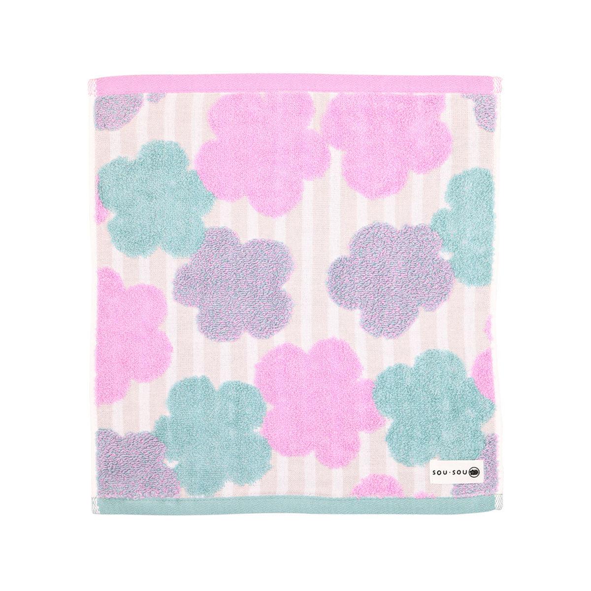 Imabani wash towel with pink, blue clover pattern on light striped background