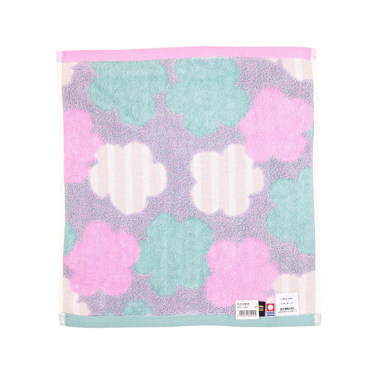 Imabani wash towel, pink and blue clover print with tag label at bottom right