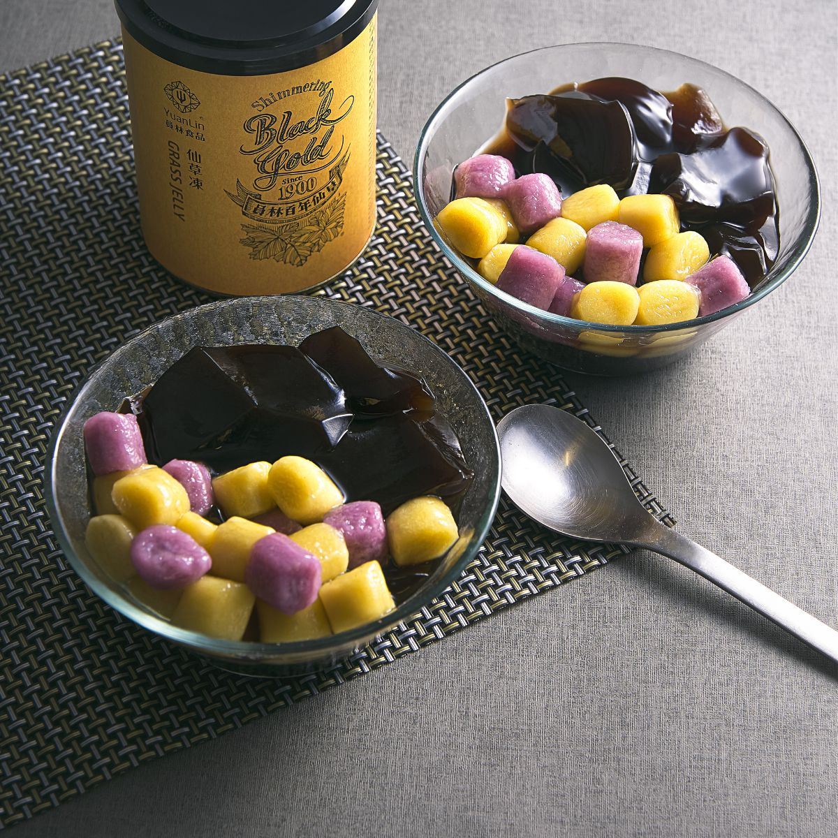 YUAN LIN grass jelly cup with purple and yellow jelly cubes and dark topping