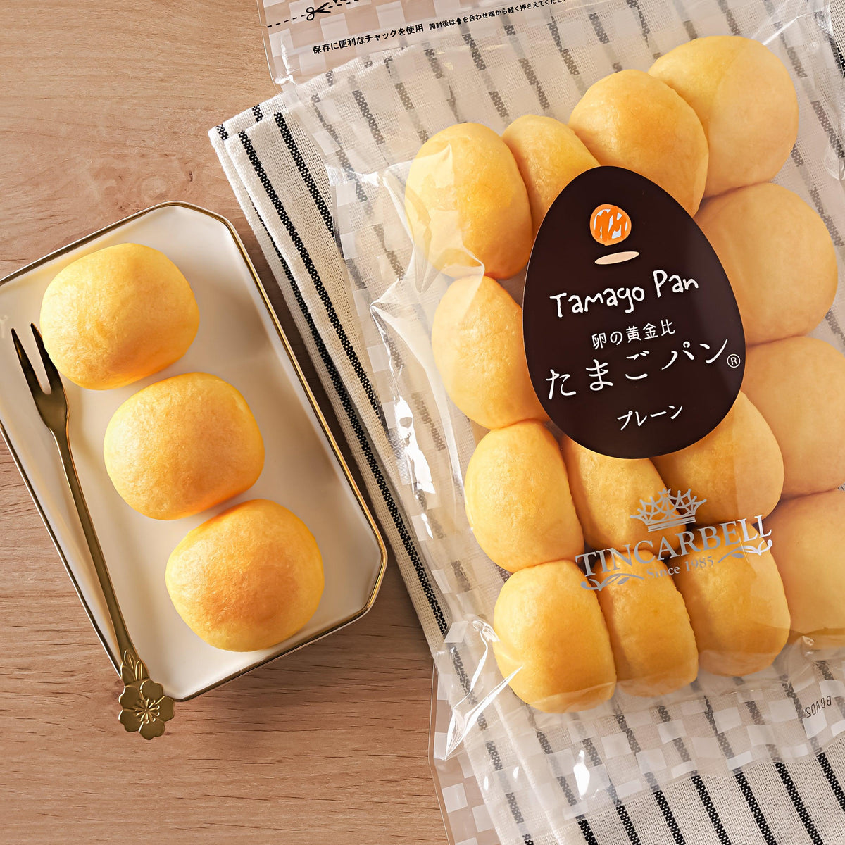 TINCARBELL egg bread bag with golden buns beside small tray