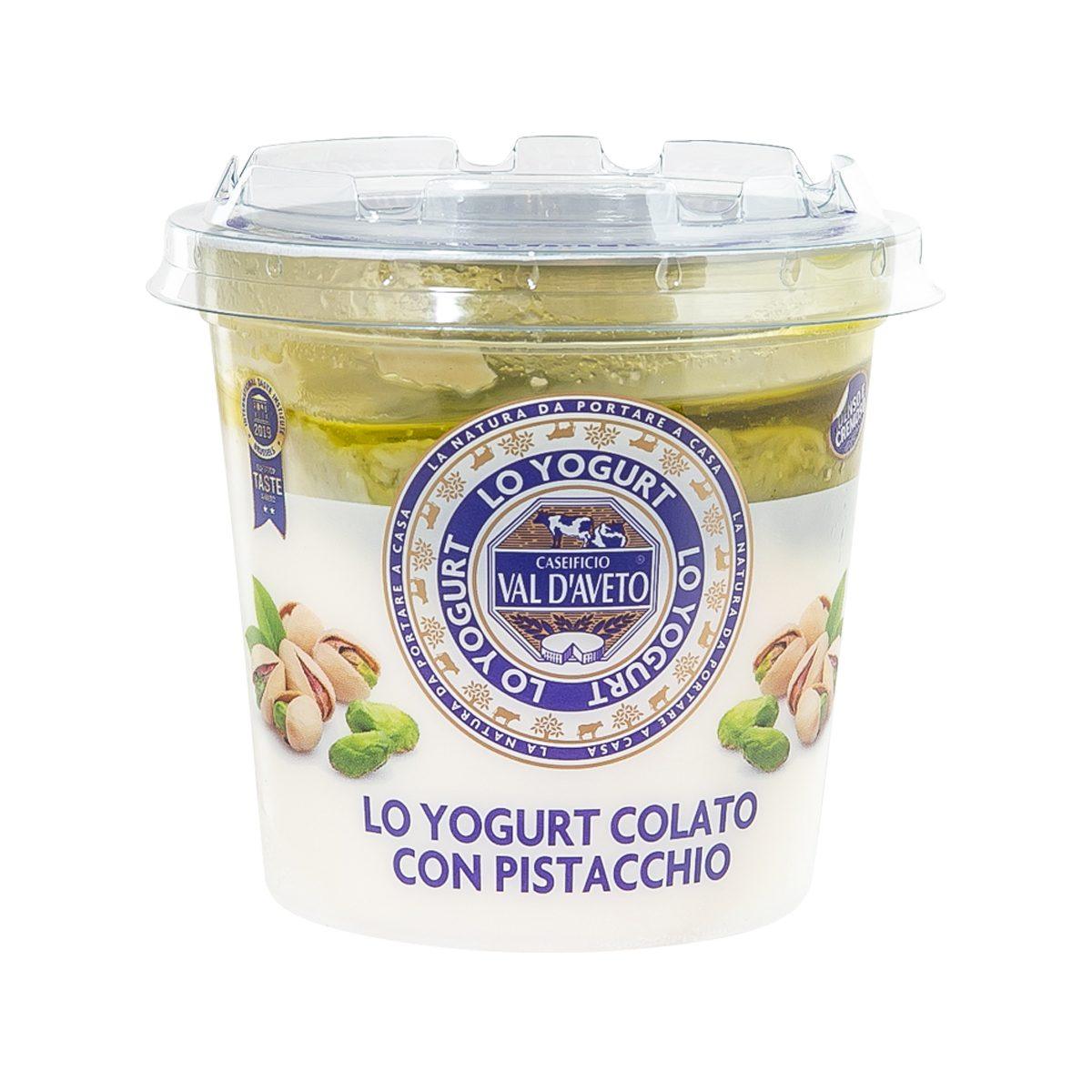 Strained pistachio yogurt in clear-lid plastic cup