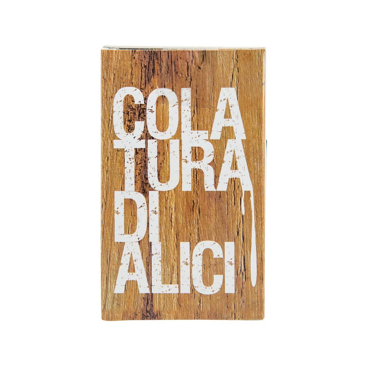 Anchovy sauce bottle with wood-textured label and large 'COLA FURBA DI ALICI' text.