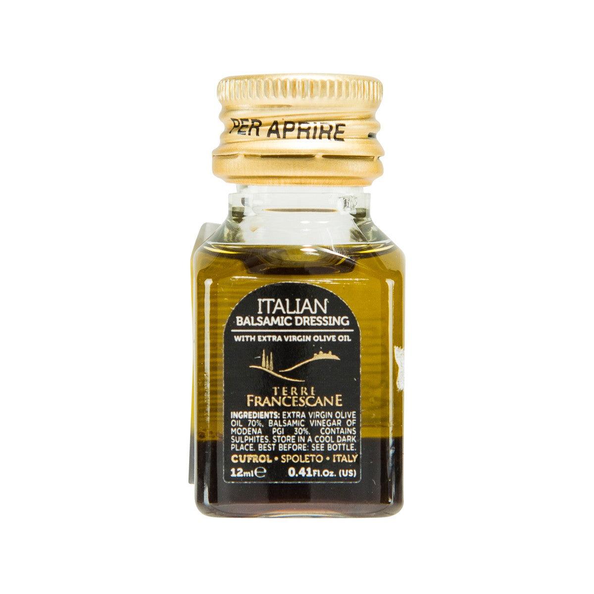 Italian balsamic dressing bottle with gold cap, clear glass and amber liquid