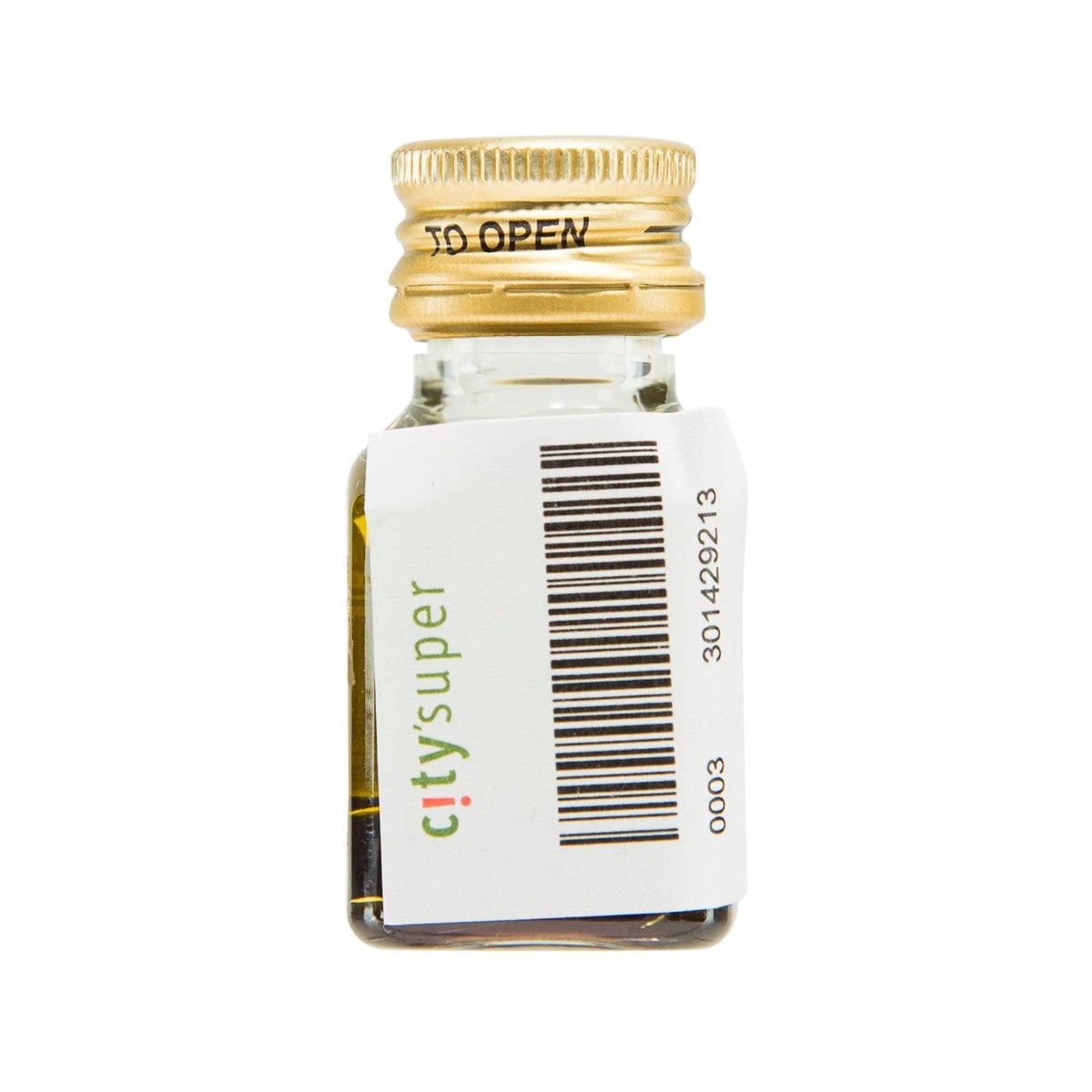 Balsamic dressing bottle with barcode on white label and gold screw cap