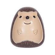 Hedgehog-shaped toothbrush holder with cream face and dark brown spines