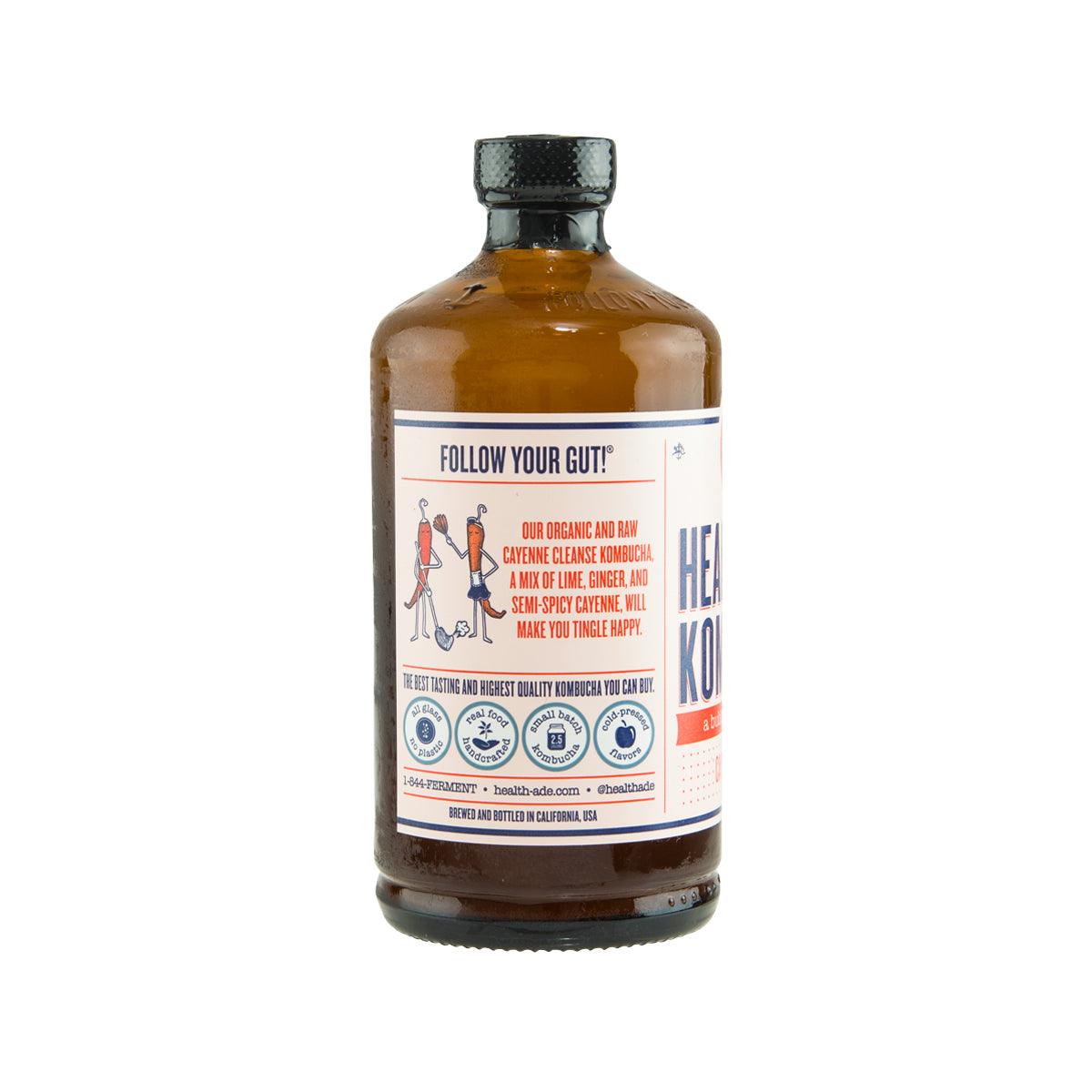 Kombucha bottle with amber liquid and back label text, cayenne cleanse