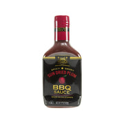 Sun dried plum BBQ sauce bottle with red cap, front label facing up