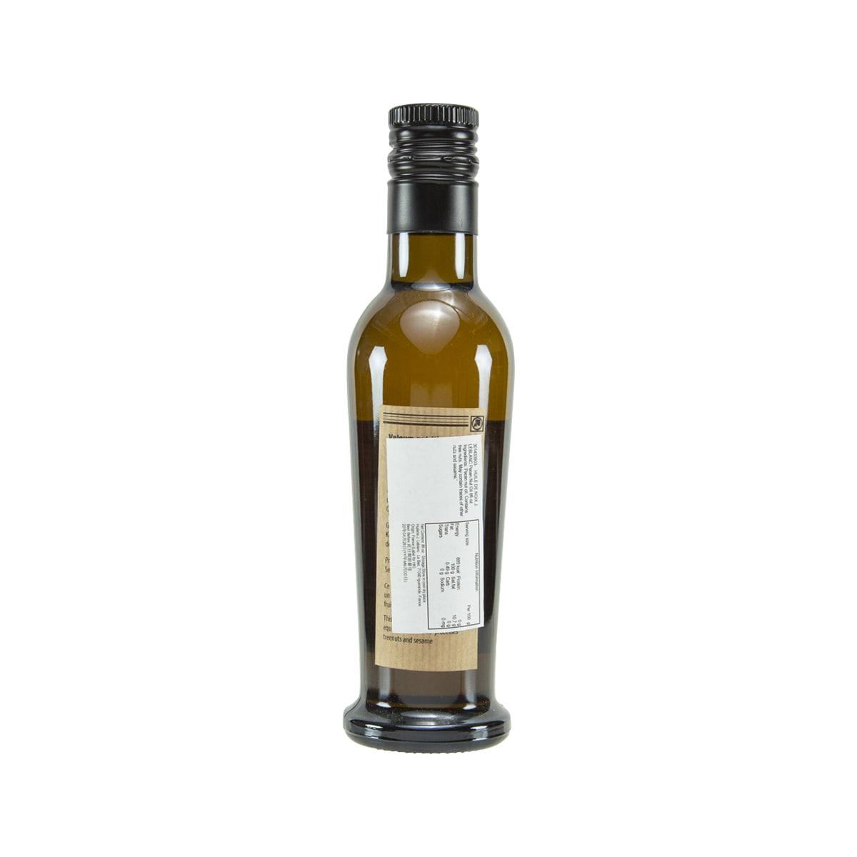 Pecan nut oil bottle by LE BLANC, amber glass with black cap and back label