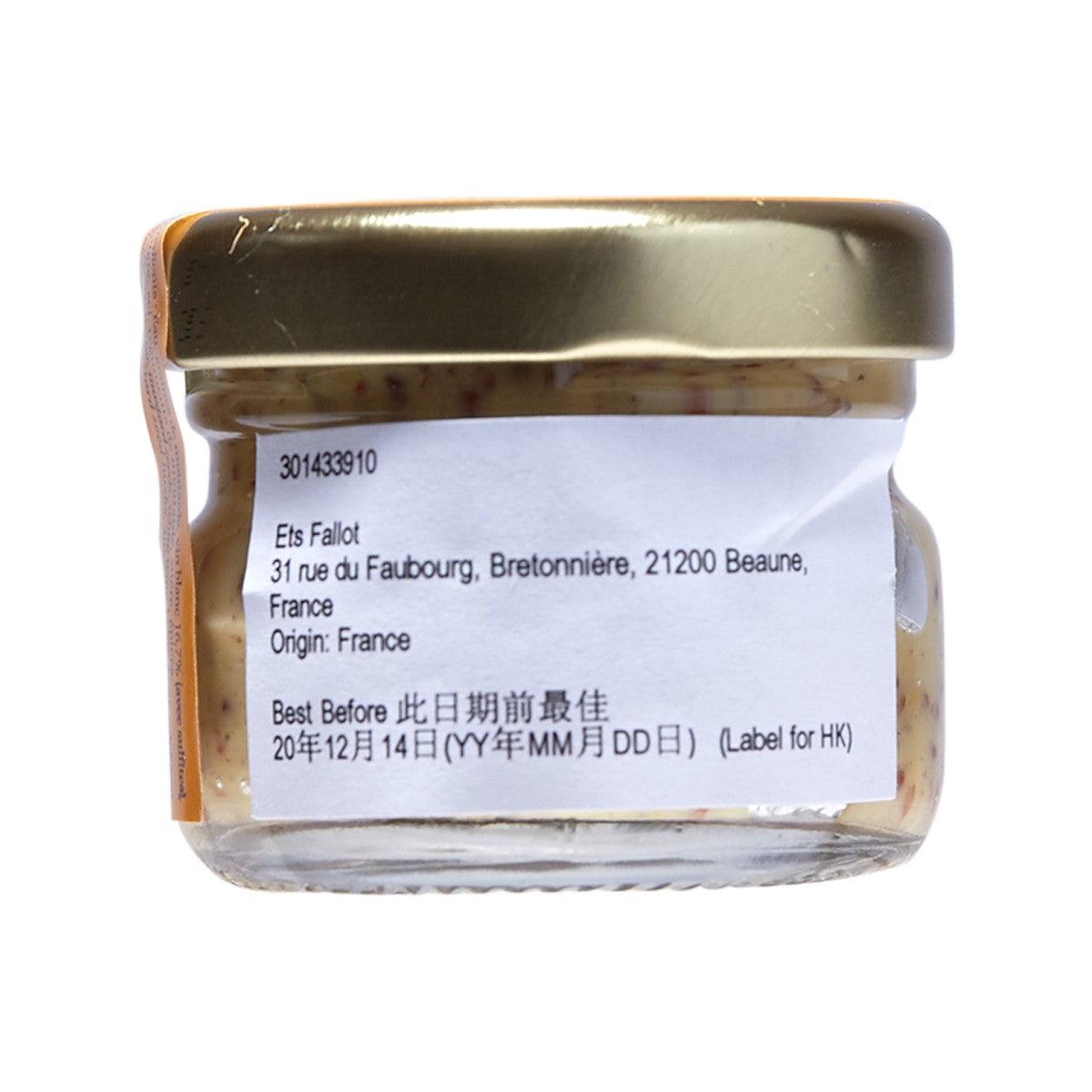 Small mustard jar back label under metal lid, glass jar with contents