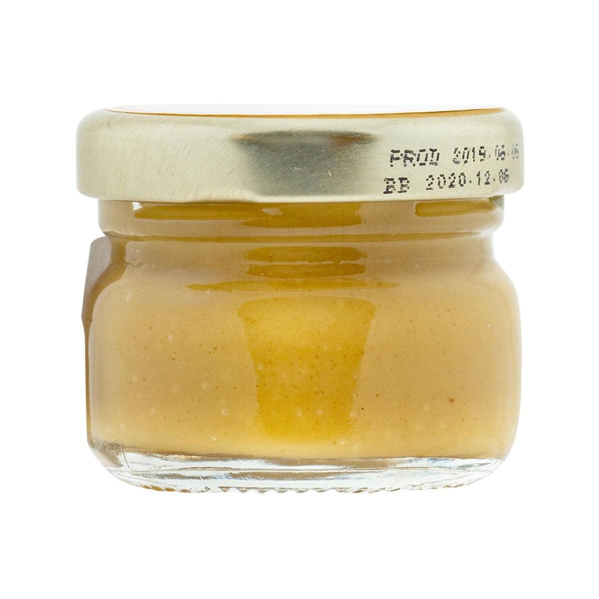 Honey & balsamic mustard in glass jar with cream-colored lid