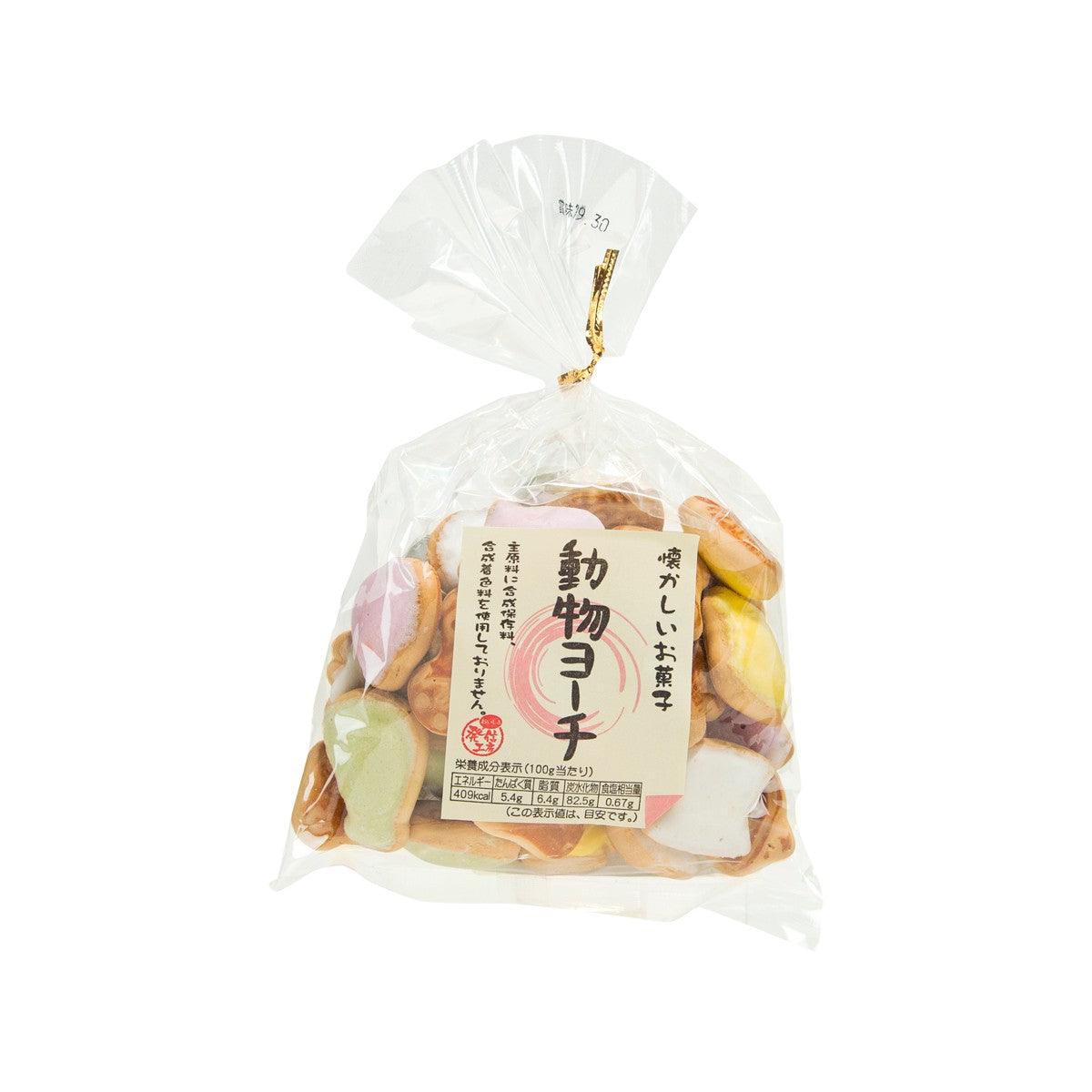 Colorful animal-shaped biscuit bag with mixed cookie pieces inside, sealed in plastic
