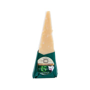 BERTINELLI aged hard cheese wedge, wrapped in green net with label