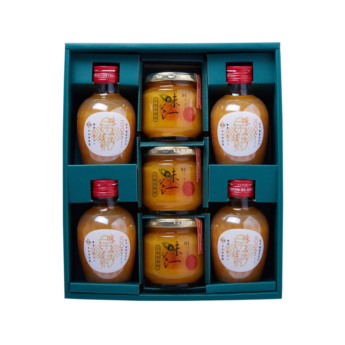 Gift set box with multiple mikan juice bottles and mikan jam jars in teal tray