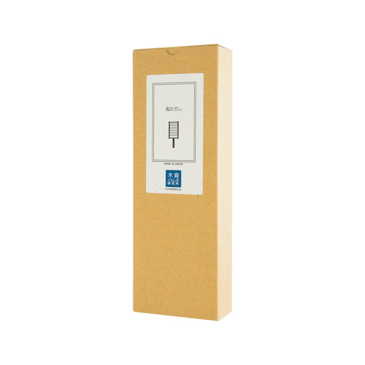 Cardboard package for wooden grater with front label and grater blade icon