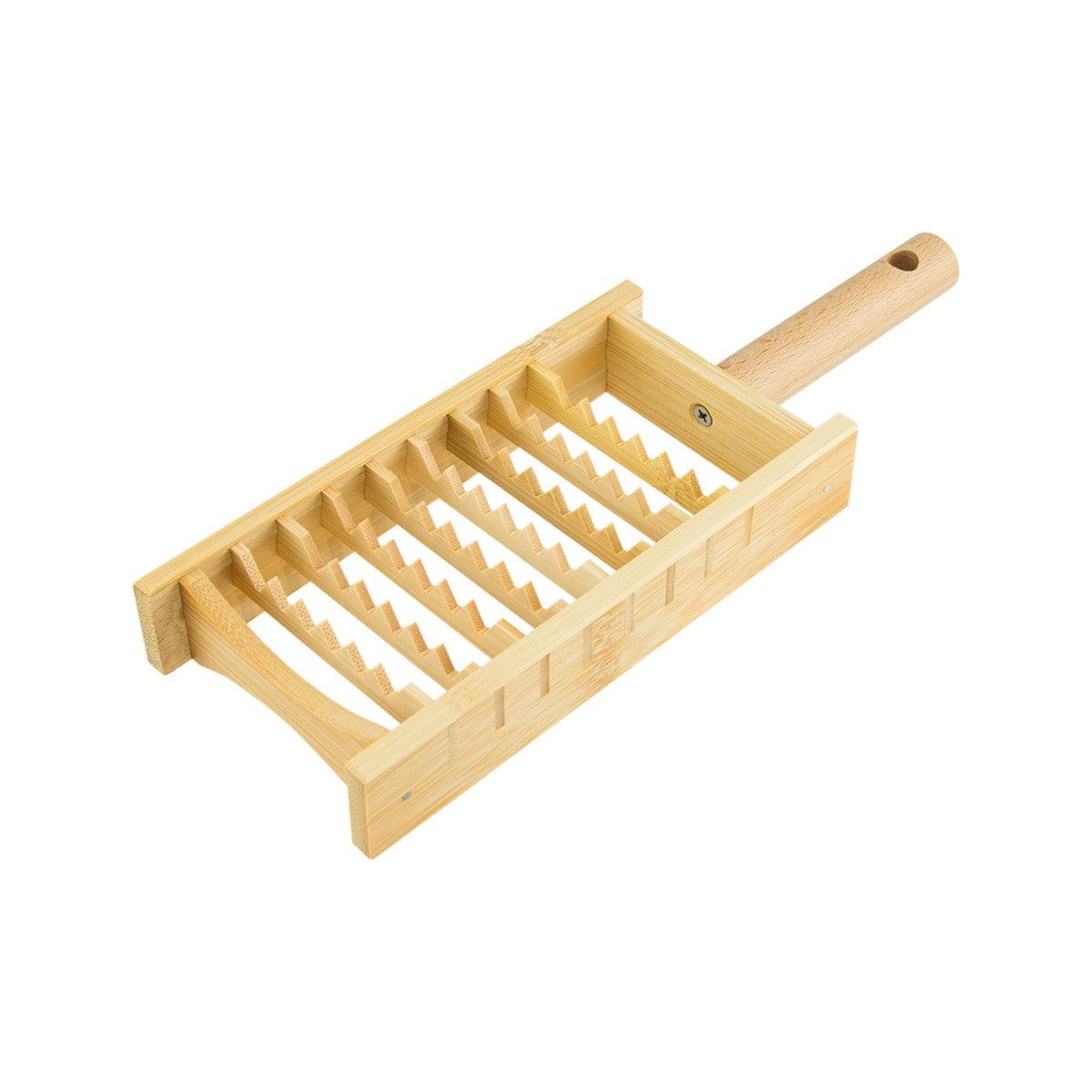 Wooden grater with rectangular frame and metal teeth, long handle