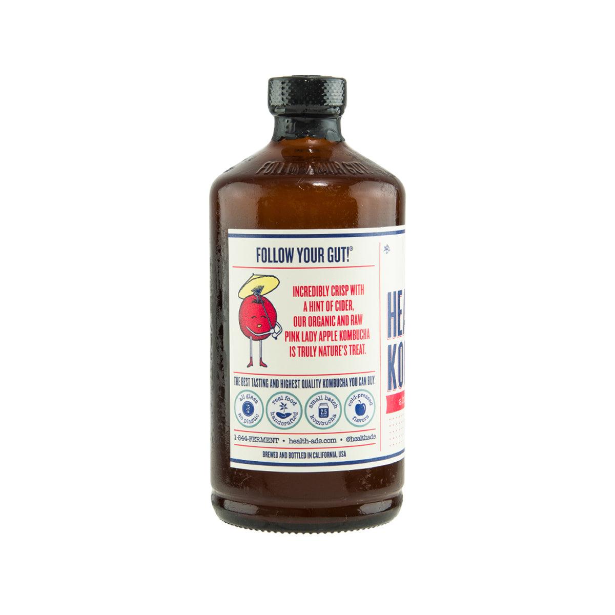 HEALTH ADE Kombucha bottle with back label text and icons, amber glass