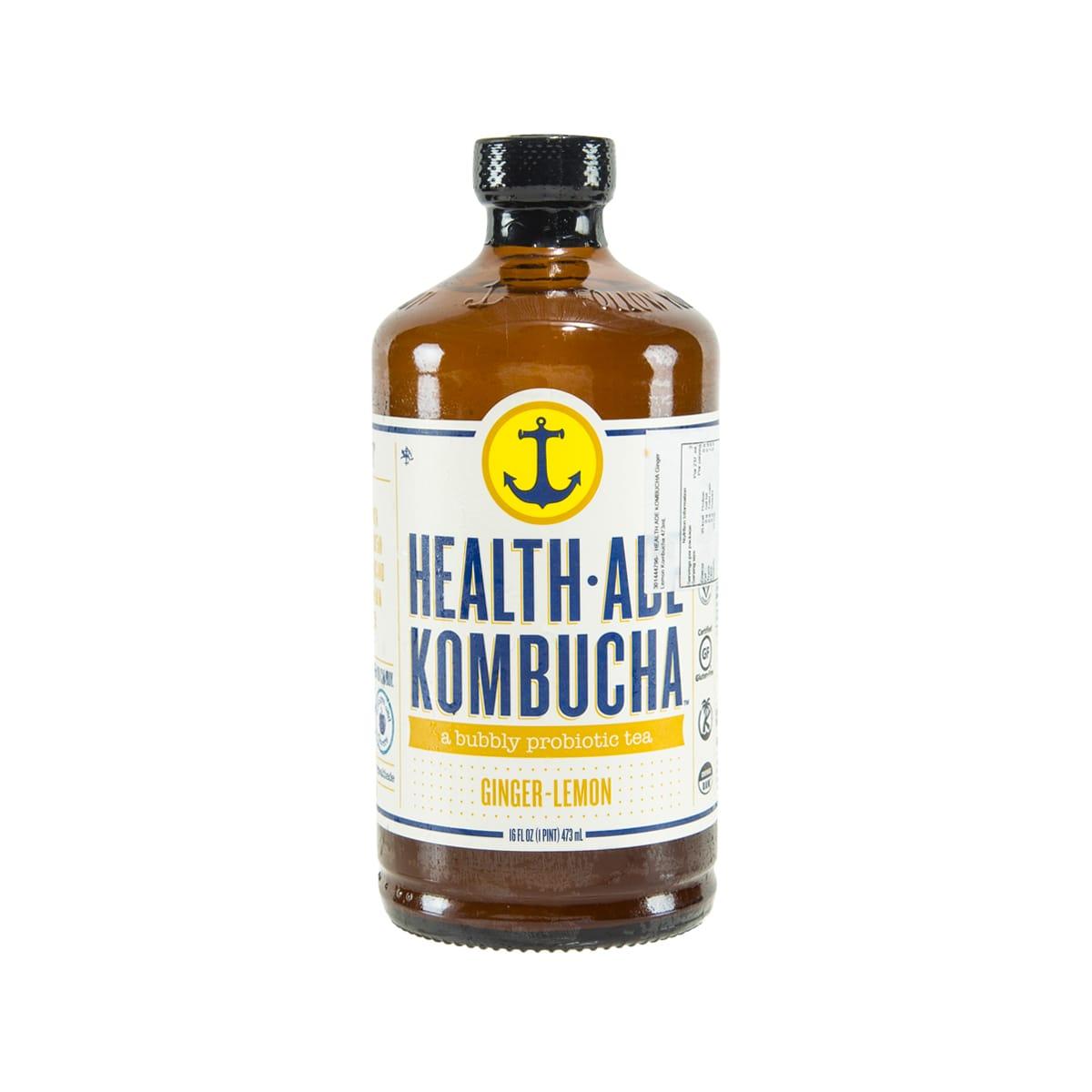 HEALTH-ADE Kombucha ginger-lemon bottle in amber glass with black cap