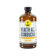 HEALTH-ADE Kombucha ginger-lemon bottle in amber glass with black cap