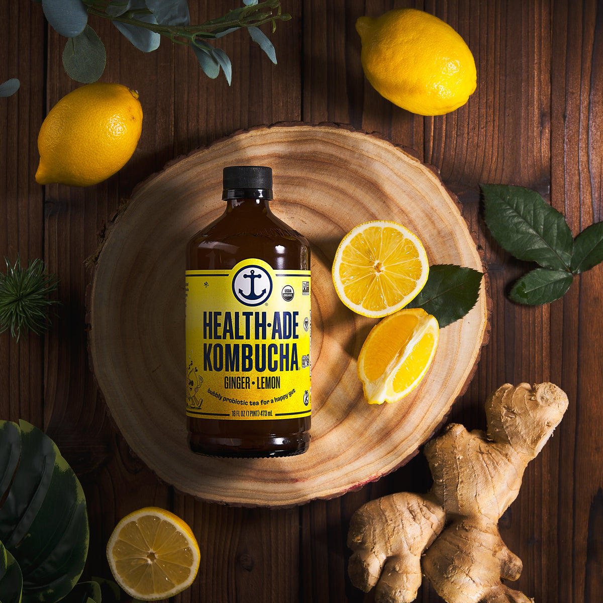 HEALTH-ADE Kombucha ginger-lemon bottle with visible lemon slices and ginger pieces
