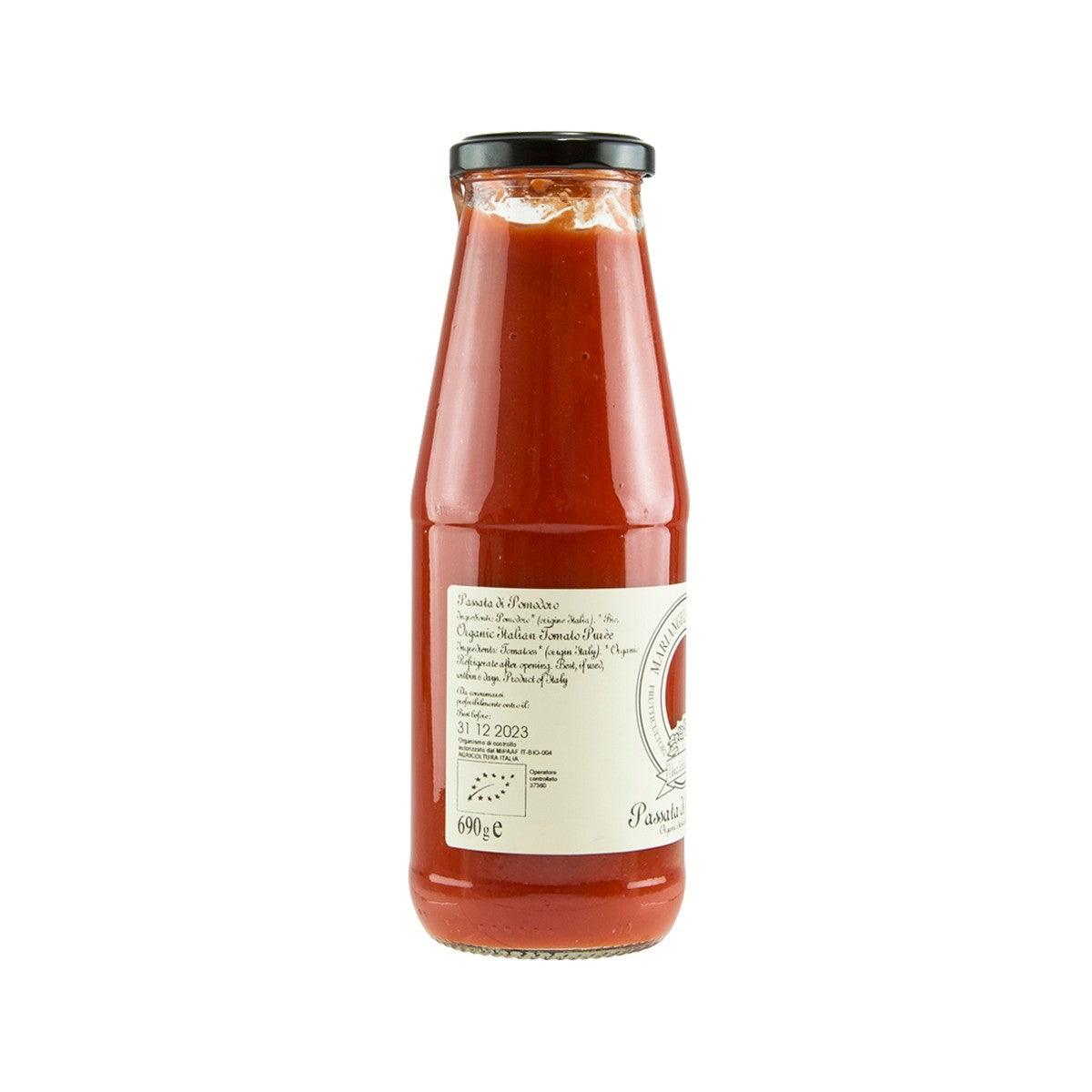 PRUNOTTO organic tomato puree jar with back label, red puree and black cap.