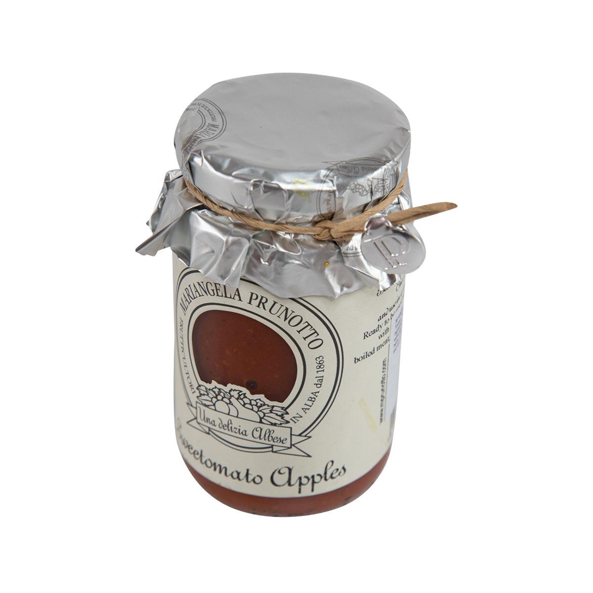 Tomato and apple pasta sauce jar with silver foil lid, angled view and cream label