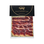 Hand-sliced Rubio Dorado shoulder ham slices in clear pack, bone-in