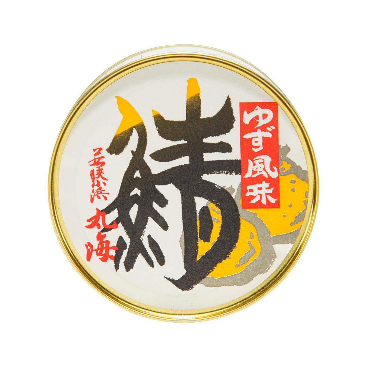 Round food can top view with gold rim and Japanese label logo