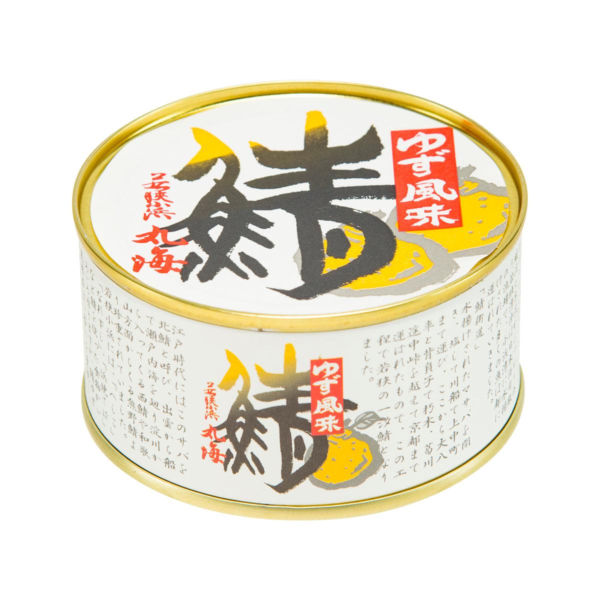 Food can with Japanese label, red seal, and yellow citrus-style graphic