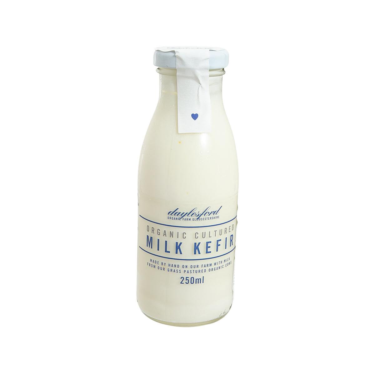 DAYLESFORD organic milk kefir in 250mL bottle, cream-colored glass with blue label