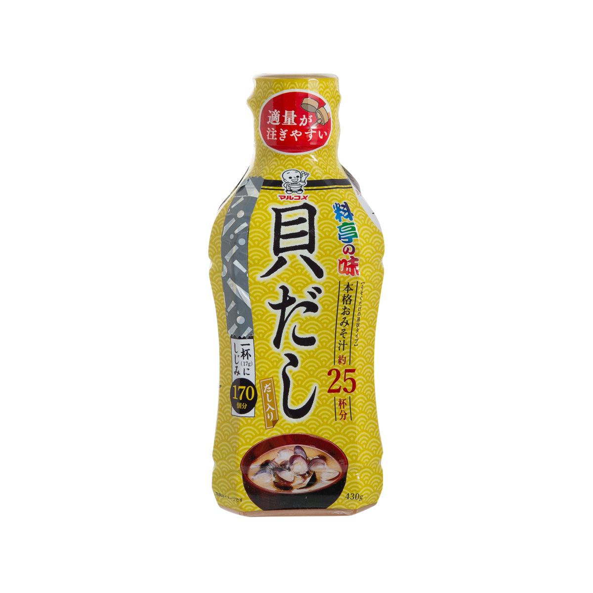 Bottle of liquid miso clam stock, yellow and gray pouch-style container