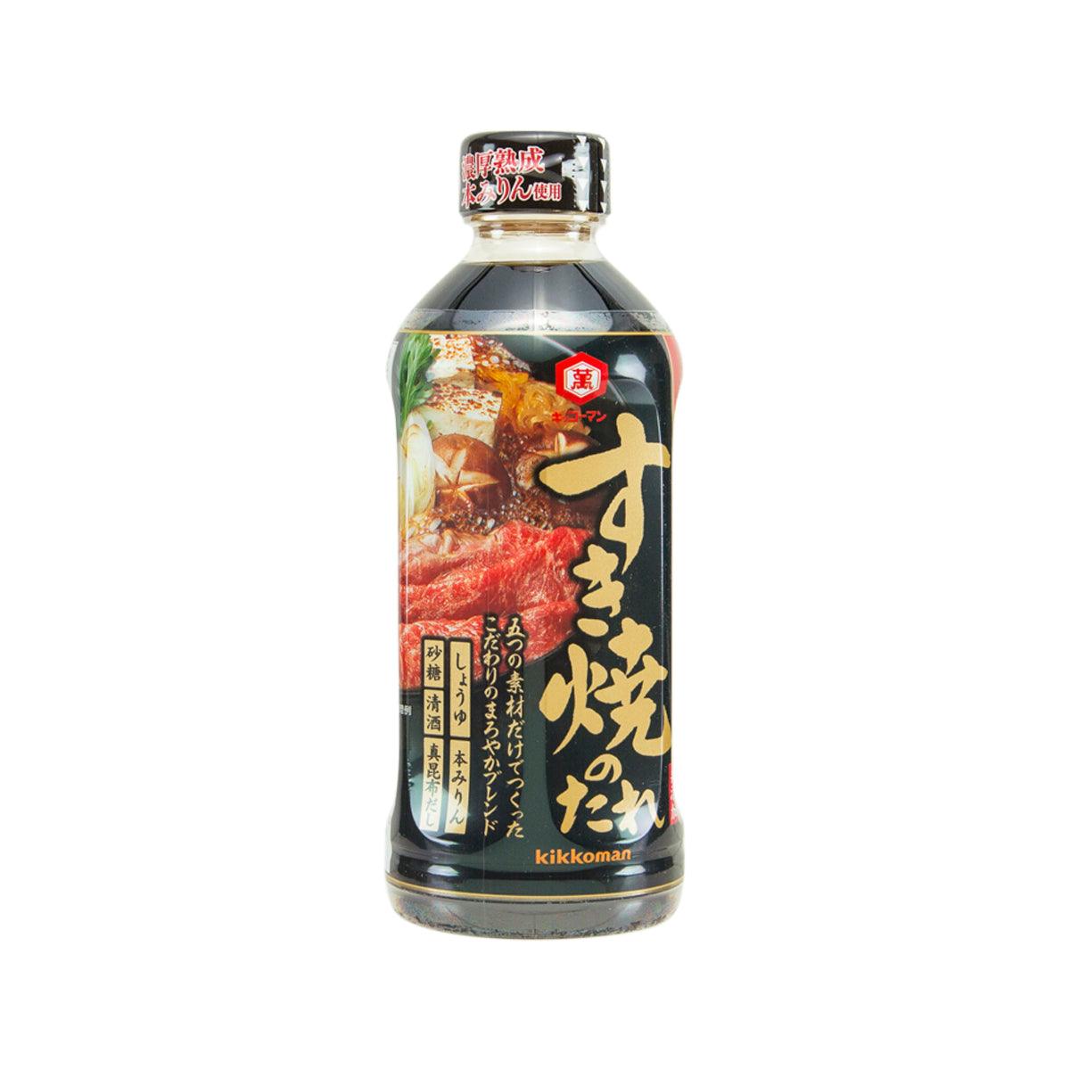 KIKKOMAN seasoning sauce bottle with dark amber liquid, front label and cap
