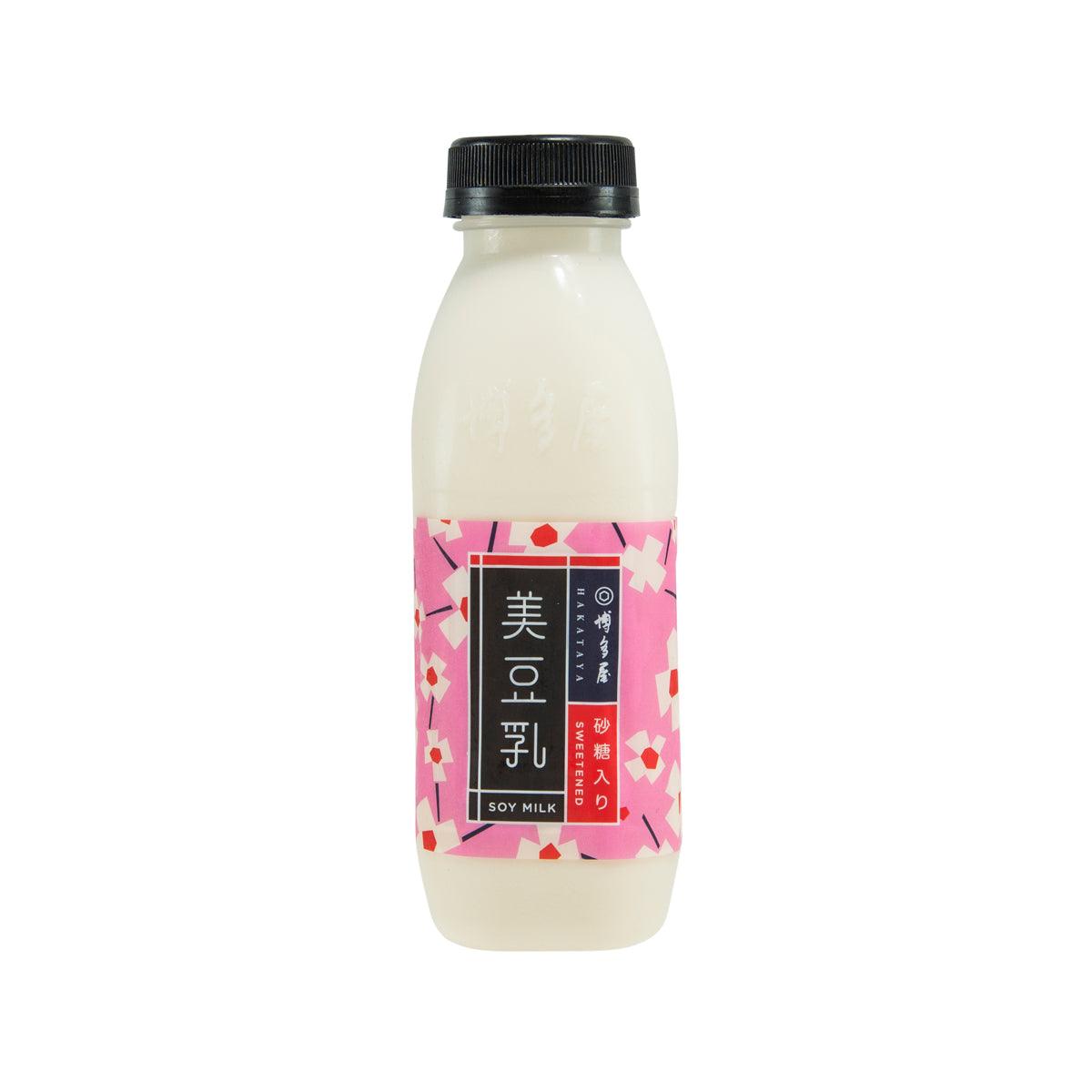 HAKATAYA sweetened soy milk bottle with pink front label and black cap on