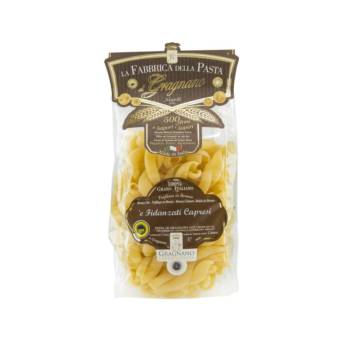 Pasta bag with artisanal capresi pasta, 250 g, showing yellow shell shapes