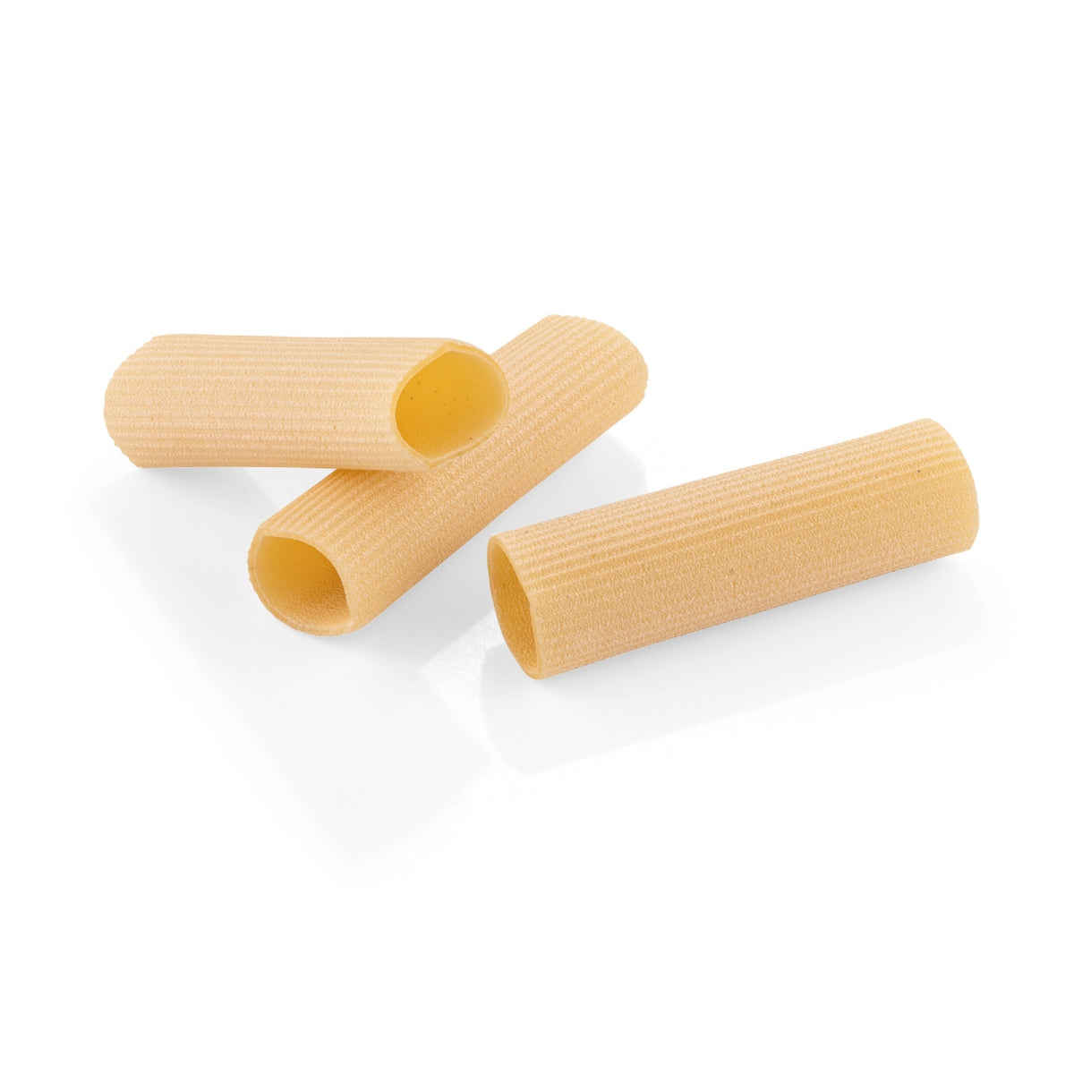 Ribbed cannelloni pasta tubes, pale golden yellow