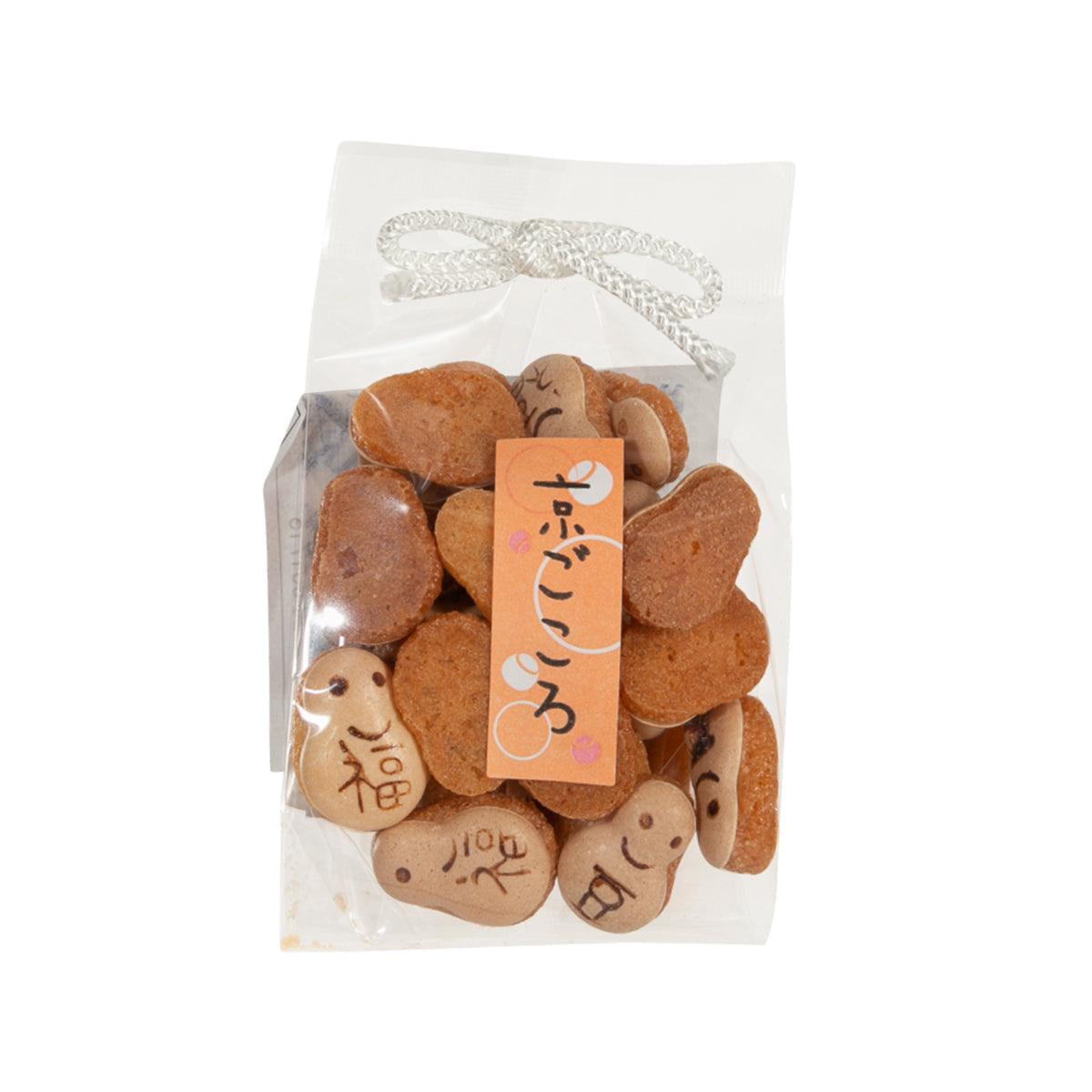 Daruma bolo cookie bag with brown daruma-face cookies