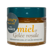 Honey and royal jelly jar with teal lid and amber honey filling