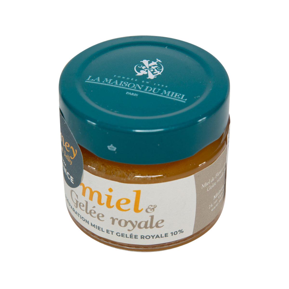 Honey and royal jelly jar with teal lid, amber filling, and front label
